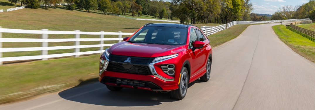 Red 2023 Mitsubishi Eclipse Cross Driving on Road Front View