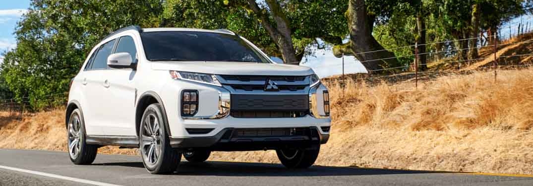 White 2023 Mitsubishi Outlander Sport Driving on Road