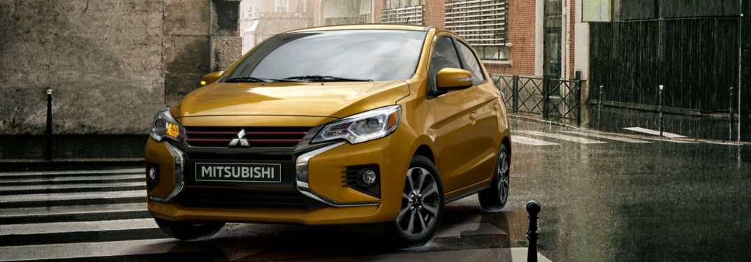 Yellow 2023 Mitsubishi Mirage Parked on Street