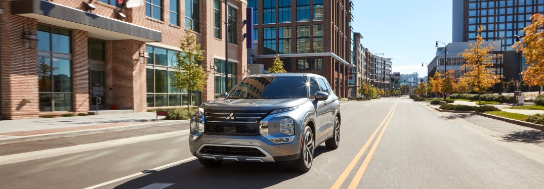 Front View of 2023 Mitsubishi Outlander Driving on Street