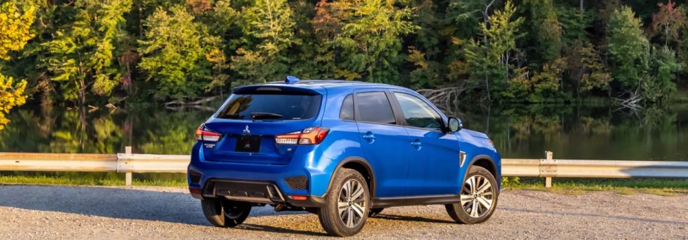 Blue Outlander Sport Parked by Water