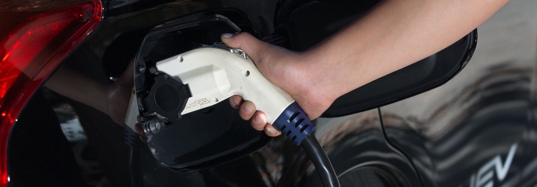 Charger Cable Plugged Into Plug-In Hybrid EV