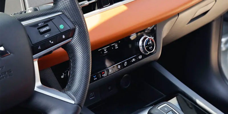 The infotainment system on a 2024 Mitsubishi Outlander PHEV which includes safety features in San Jose, CA