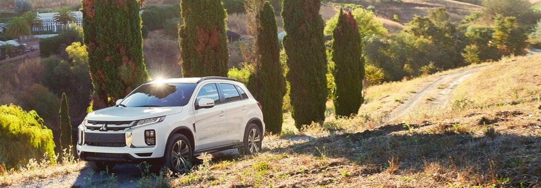 White 2024 Mitsubishi Outlander Sport Parked on Hill