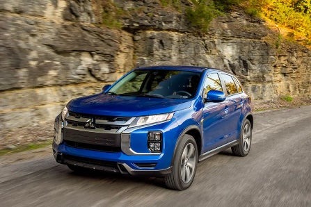 Blue 2024 Mitsubishi Outlander Sport Driving on Road